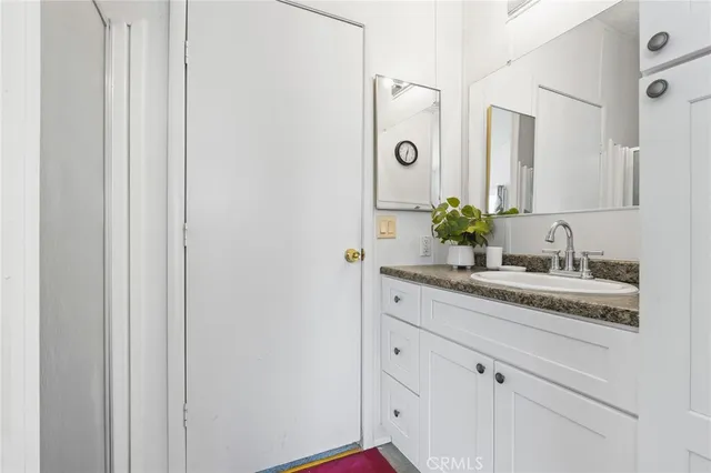 a white bath tub sitting next to a white toilet