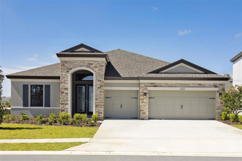 12977 Long Valley Cir Spring Hill Spring Hill, FL 34609 - Photo 1 of 1 a front view of a house with garden