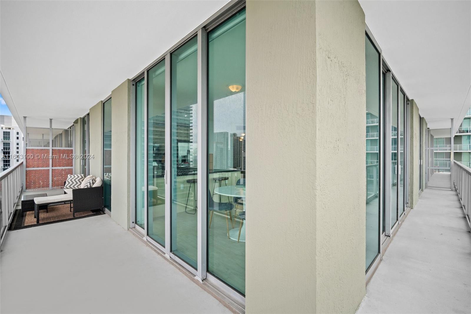 1111 Southwest 1st Avenue, Unit 3425N Miami, FL 33130 - Photo 19 of 35 a view of a living room hardwood floor and a balcony