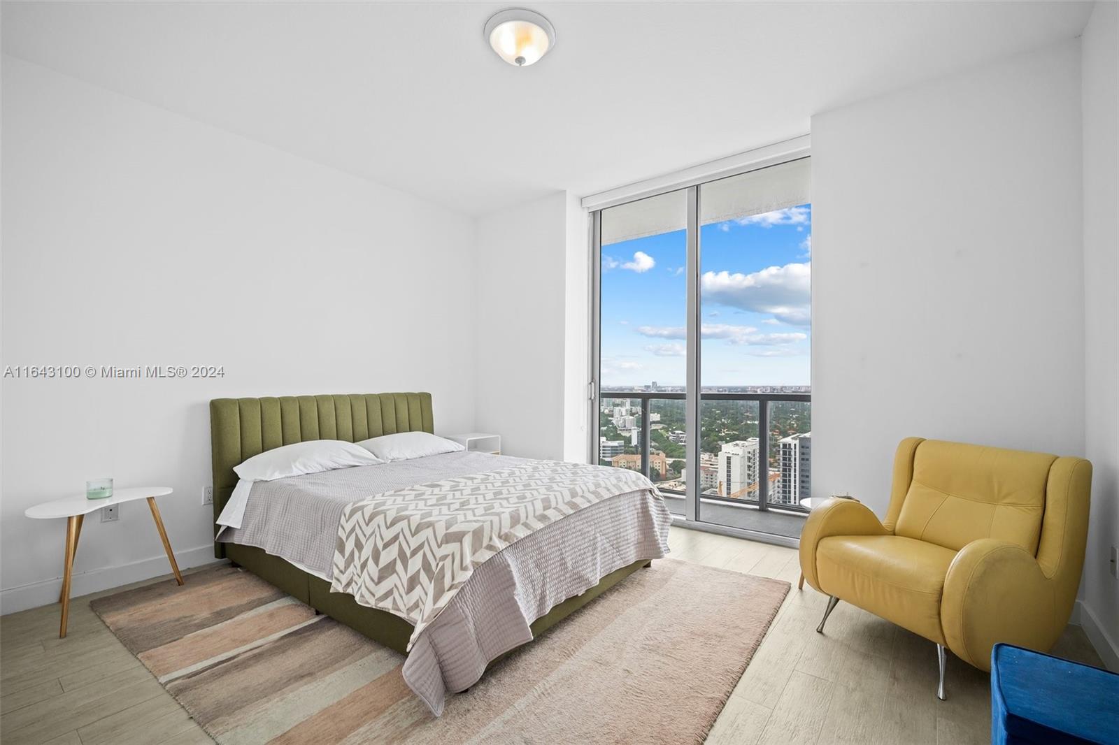 1111 Southwest 1st Avenue, Unit 3425N Miami, FL 33130 - Photo 10 of 35 a bedroom with a bed and a couch