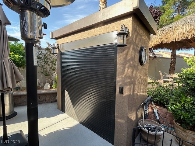 8175 Arville Street, Unit 210 Las Vegas, NV 89139 - Photo 18 of 36 View of side of home with a patio and stucco siding