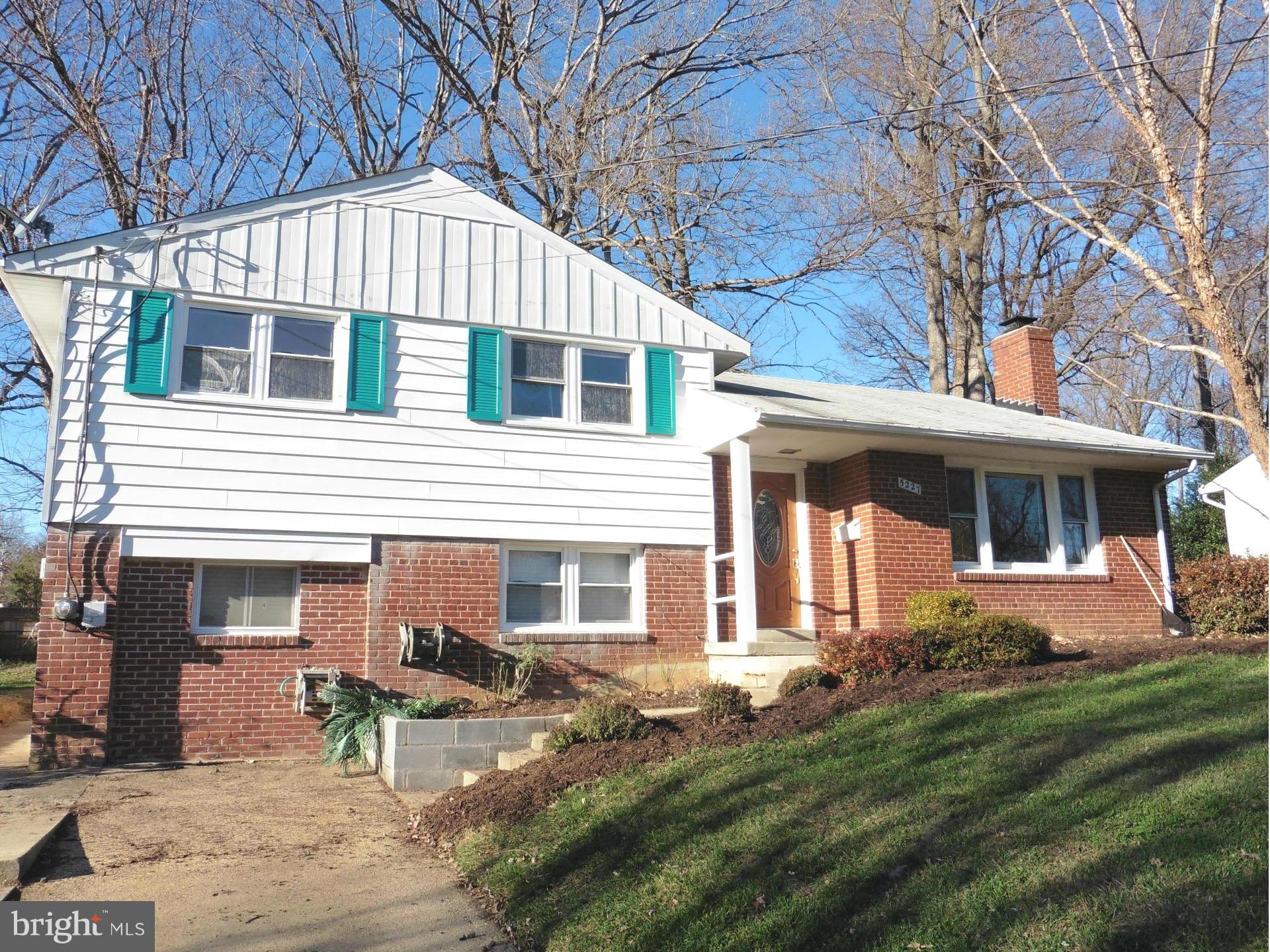 5227 Ravensworth Road Springfield, VA 22151 - Photo 1 of 27 a front view of a house with a yard