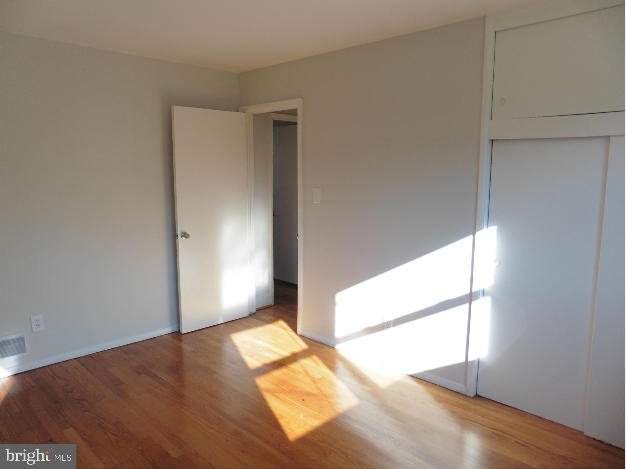 5227 Ravensworth Road Springfield, VA 22151 - Photo 12 of 27 a view of empty room with wooden floor