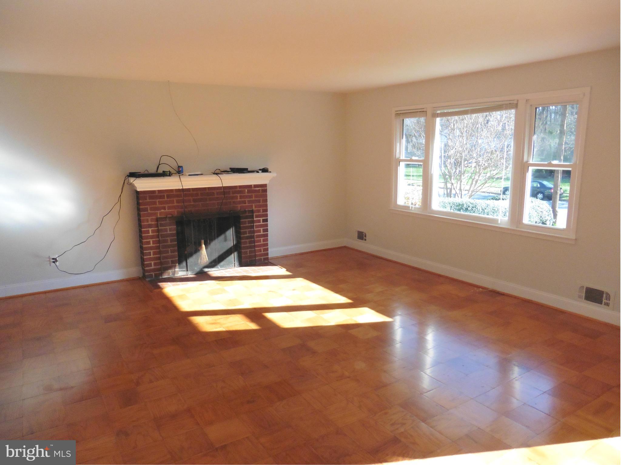 5227 Ravensworth Road Springfield, VA 22151 - Photo 13 of 27 a view of empty room with wooden floor and fan