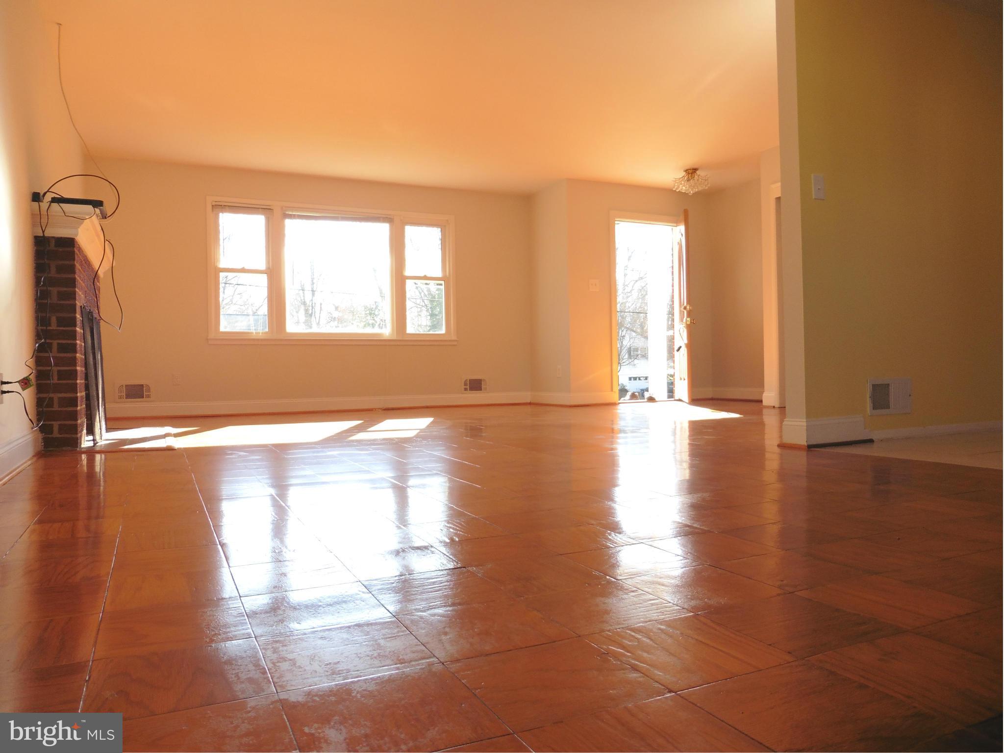 5227 Ravensworth Road Springfield, VA 22151 - Photo 14 of 27 a view of empty room with wooden floor and fan
