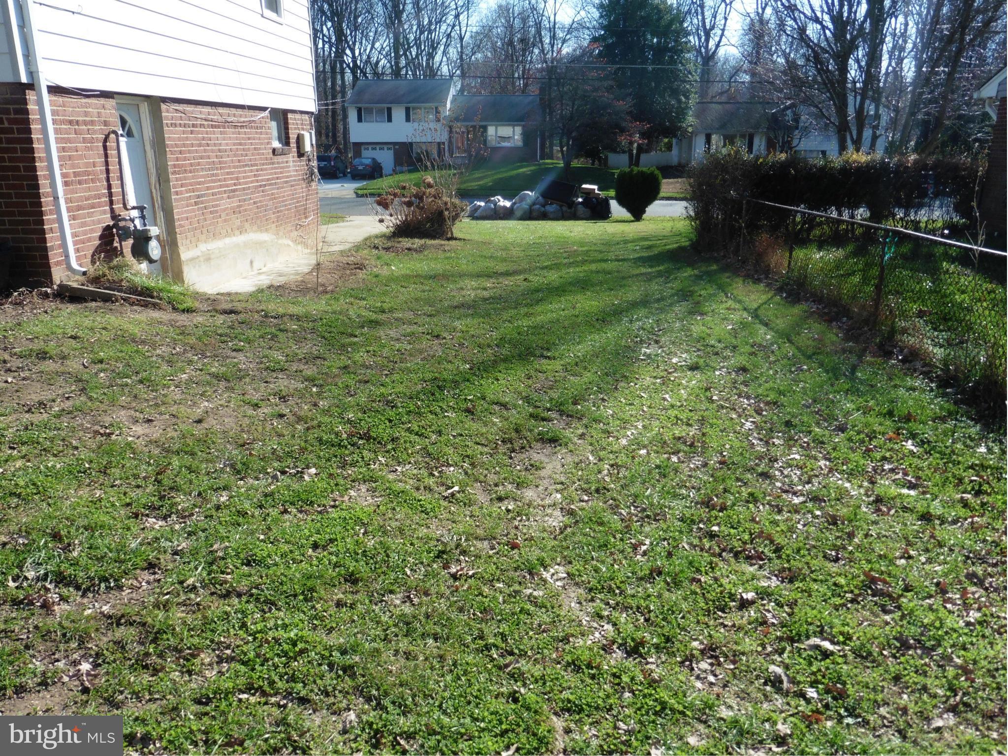 5227 Ravensworth Road Springfield, VA 22151 - Photo 18 of 27 a view of a backyard with wooden fence