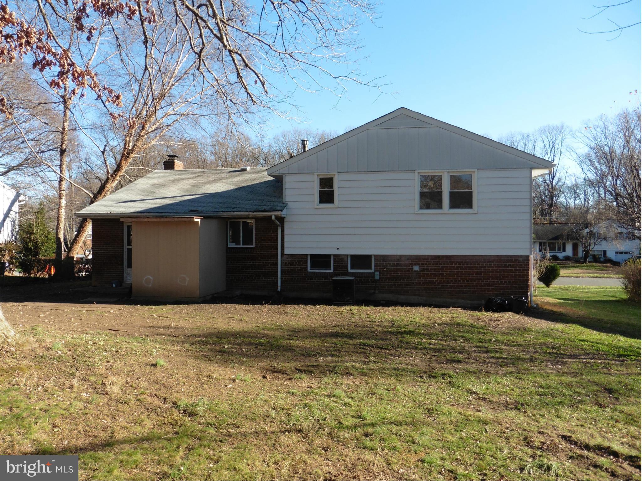 5227 Ravensworth Road Springfield, VA 22151 - Photo 3 of 27 a front view of a house with a yard