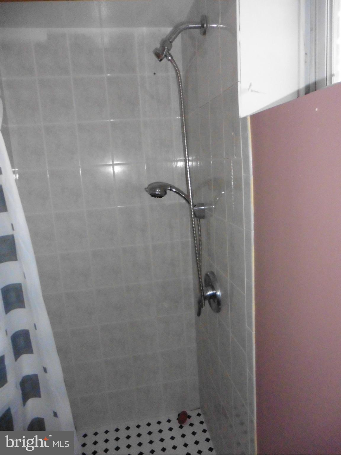 5227 Ravensworth Road Springfield, VA 22151 - Photo 23 of 27 a bathroom with a shower
