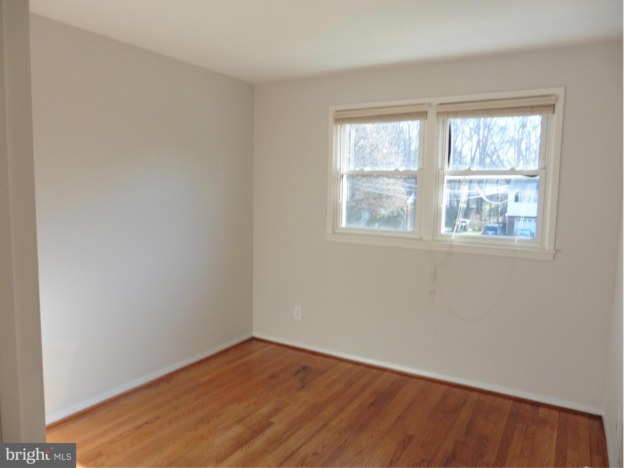 5227 Ravensworth Road Springfield, VA 22151 - Photo 8 of 27 an empty room with a window