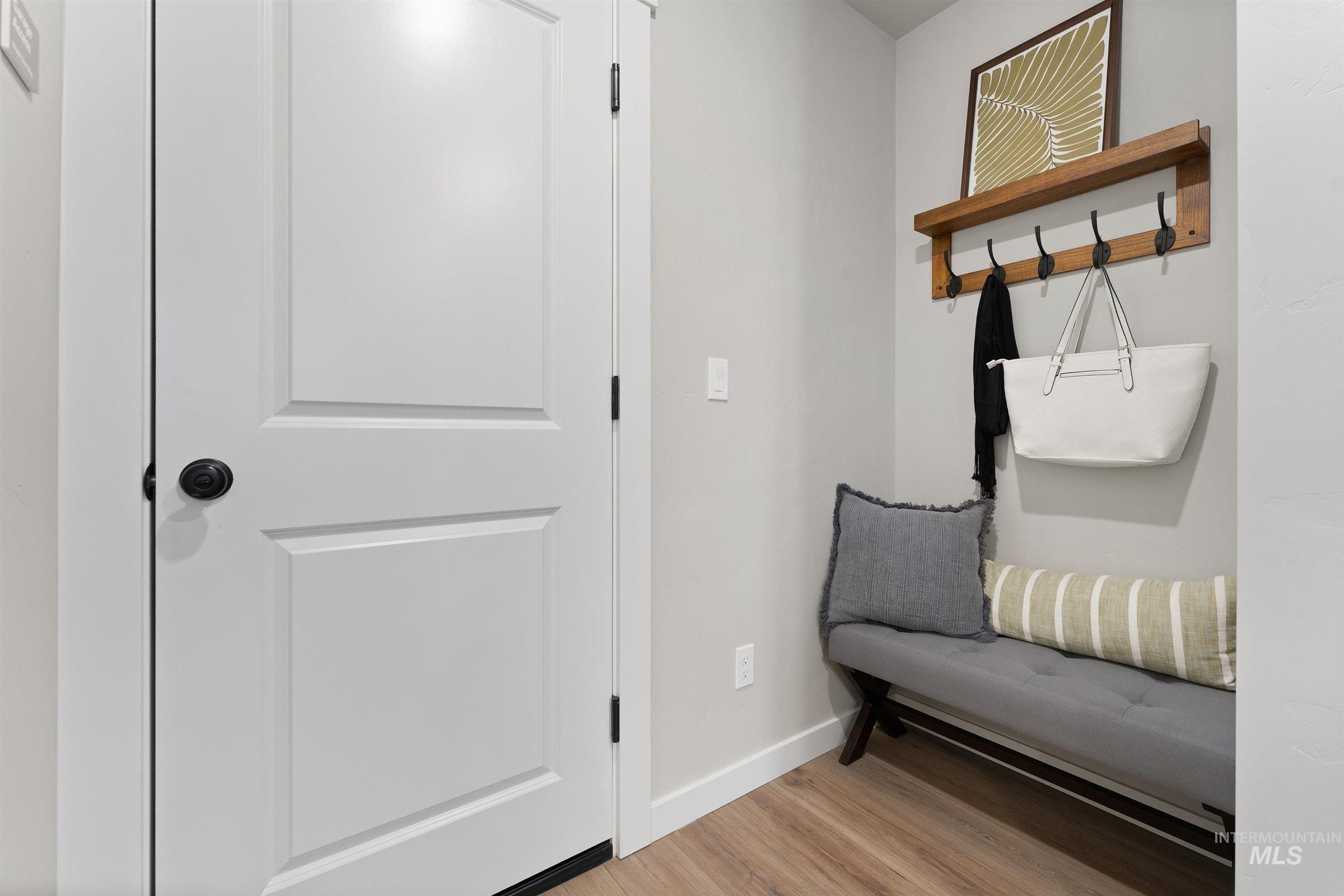 4141 South Colditz Way Meridian, ID 83642 - Photo 12 of 40 Living area featuring baseboards and light wood-style flooring