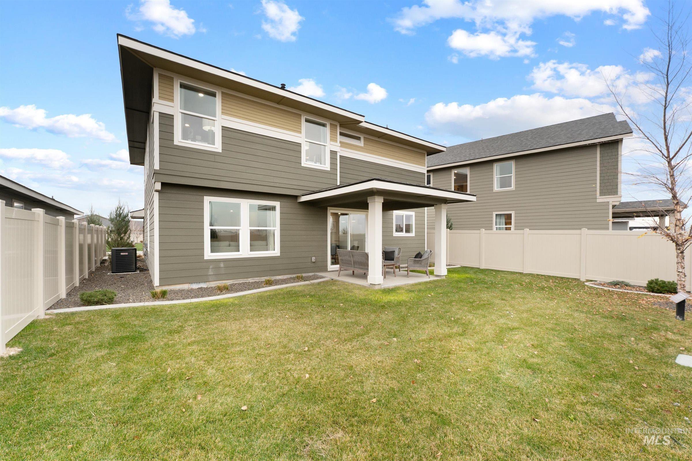 4141 South Colditz Way Meridian, ID 83642 - Photo 28 of 40 Back of property with a patio and a fenced backyard
