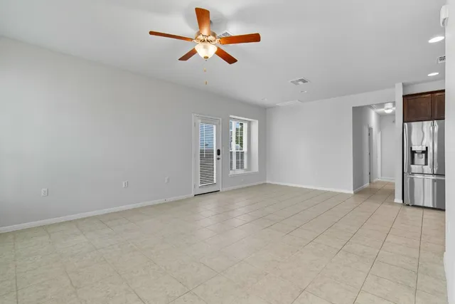 a view of livingroom with hardwood floor and a ceiling fan