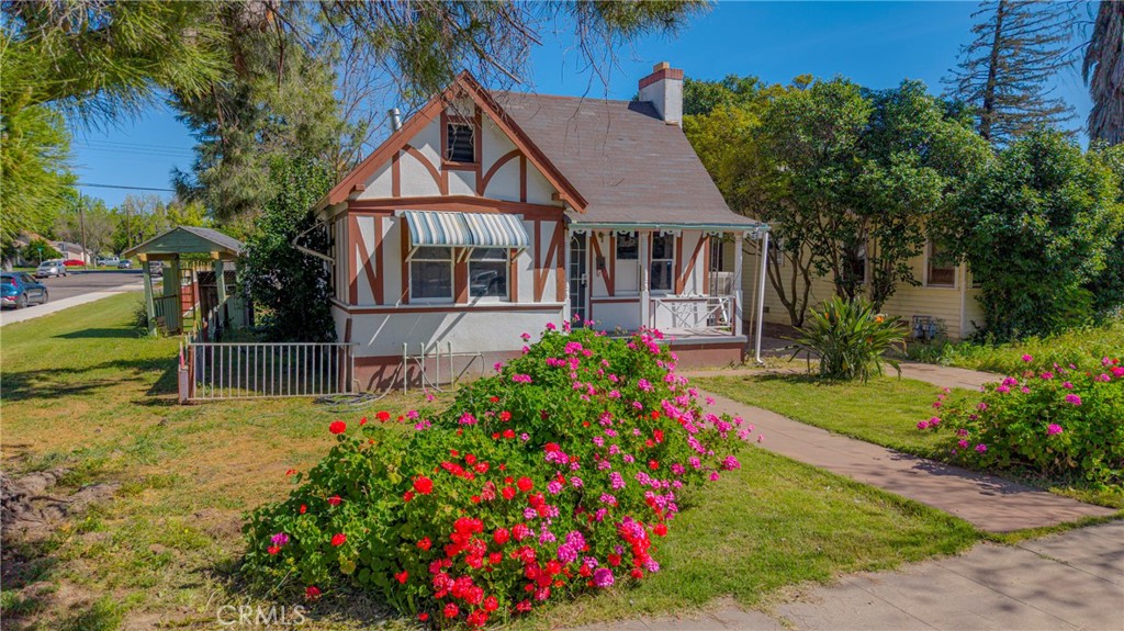261 West 26th Street Merced, CA 95340 - Photo 12 of 40 a view of a house with a big yard and potted plants