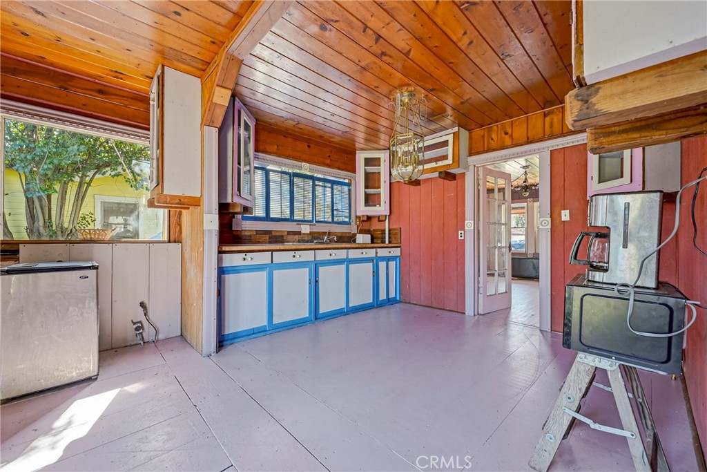 261 West 26th Street Merced, CA 95340 - Photo 25 of 40 a kitchen with stainless steel appliances granite countertop a stove and a refrigerator