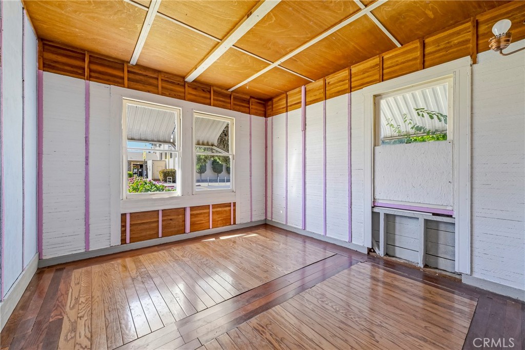 261 West 26th Street Merced, CA 95340 - Photo 31 of 40 a view of empty room with wooden floor and fan