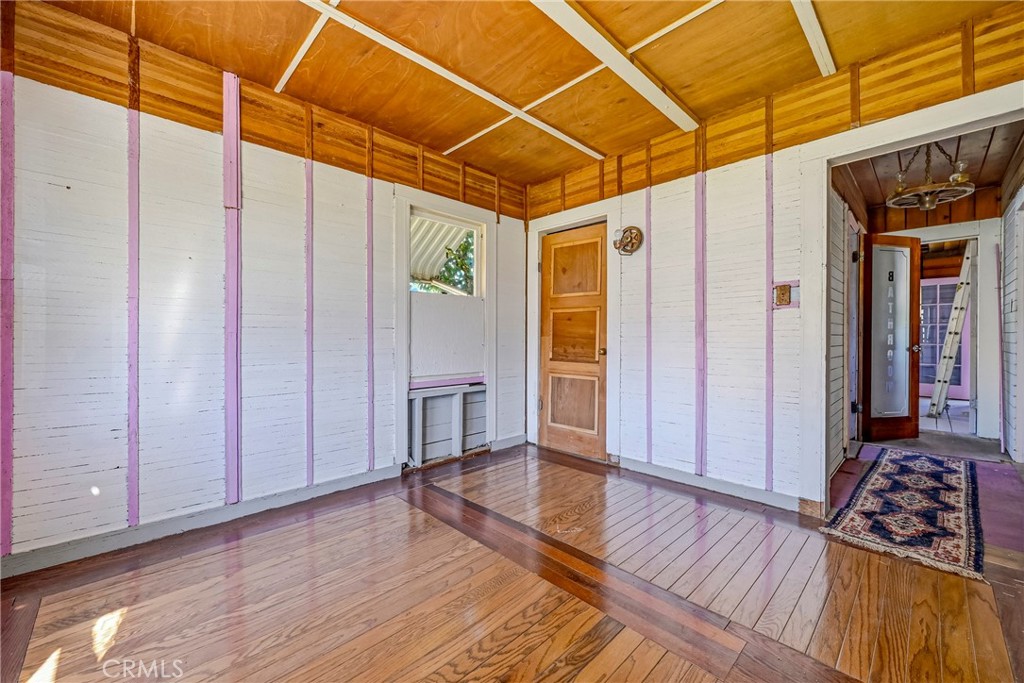 261 West 26th Street Merced, CA 95340 - Photo 32 of 40 a view of a room with wooden floor and furniture