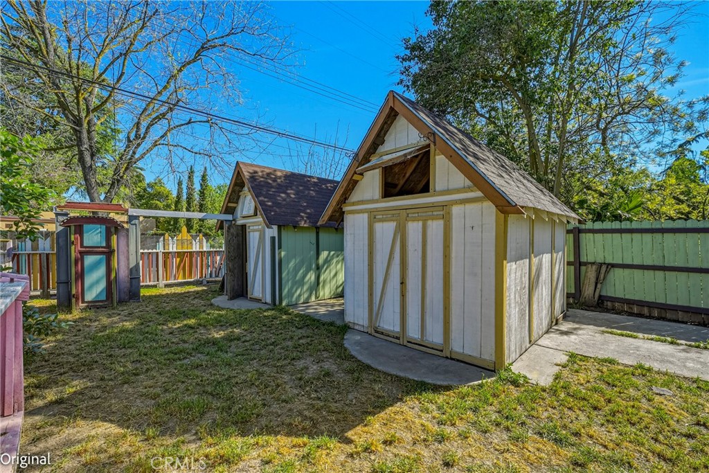 261 West 26th Street Merced, CA 95340 - Photo 38 of 40 a view of a small house with wooden fence