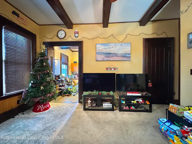a view of a kitchen with furniture and a window
