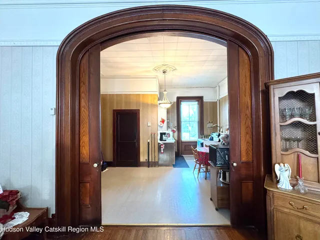 a kitchen with stainless steel appliances kitchen island granite countertop a refrigerator and a sink