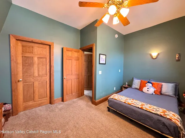 a living room with furniture fireplace and a large window