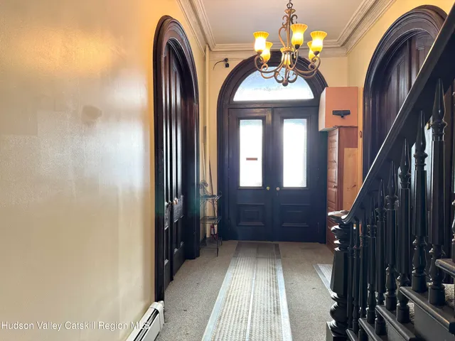 a view of hall way with mirror