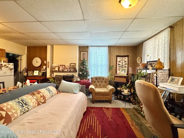 a bedroom with double bed and a large window