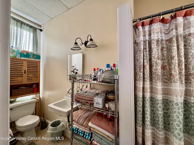 a table with wine bottles and glasses on it