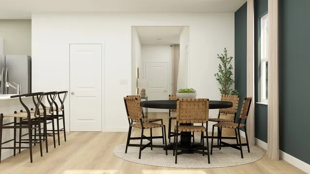 a view of a dining room with furniture and a window
