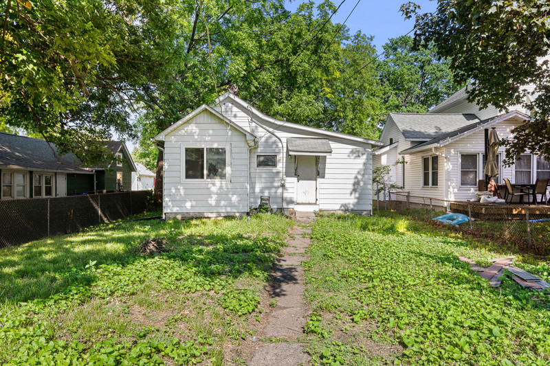 1419 17th Street Moline, IL 61265 - Photo 27 of 28 a front view of a house with a yard