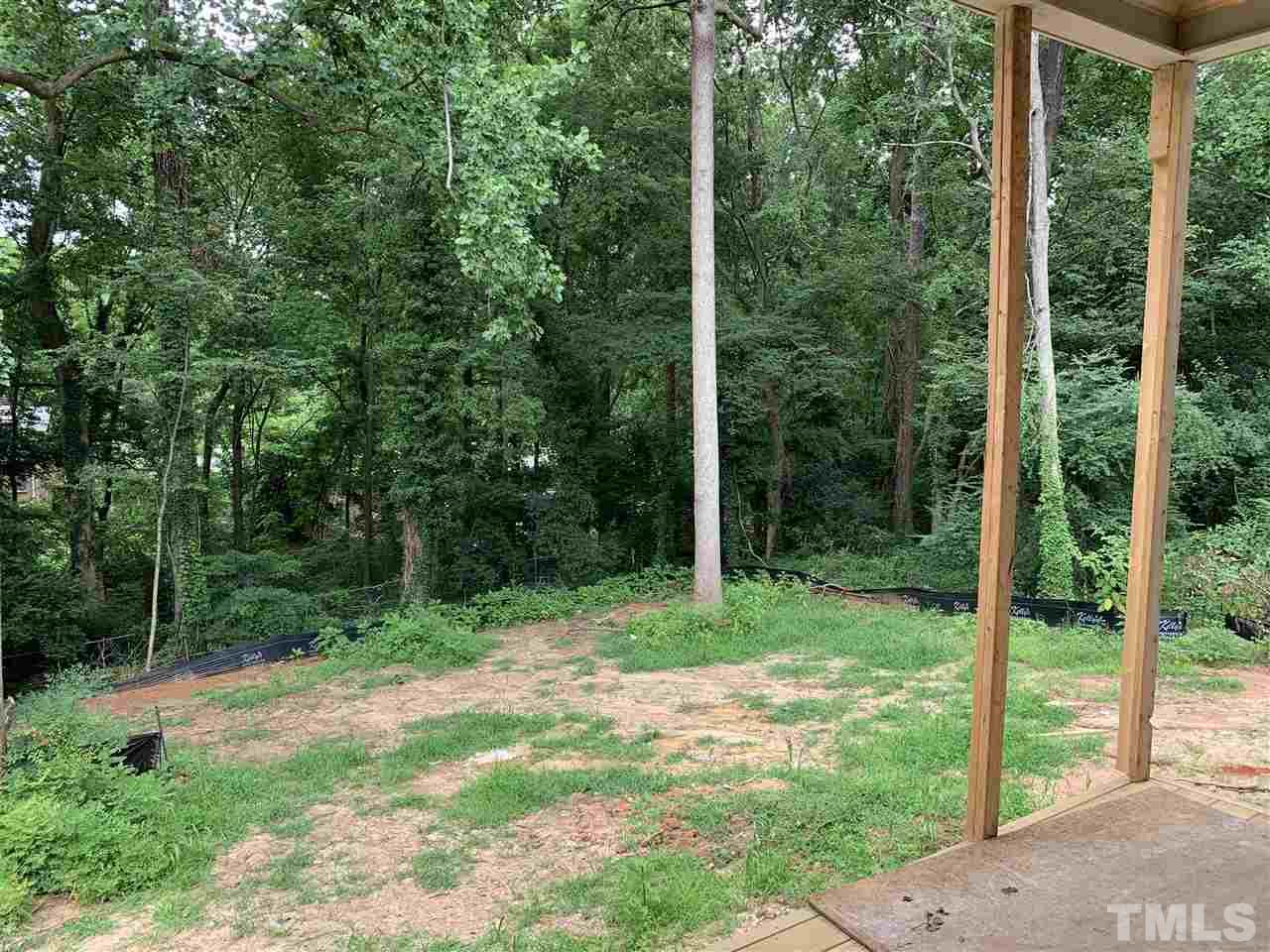 4224 Lambeth Drive Raleigh, NC 27609 - Photo 5 of 7 a view of a backyard with a garden