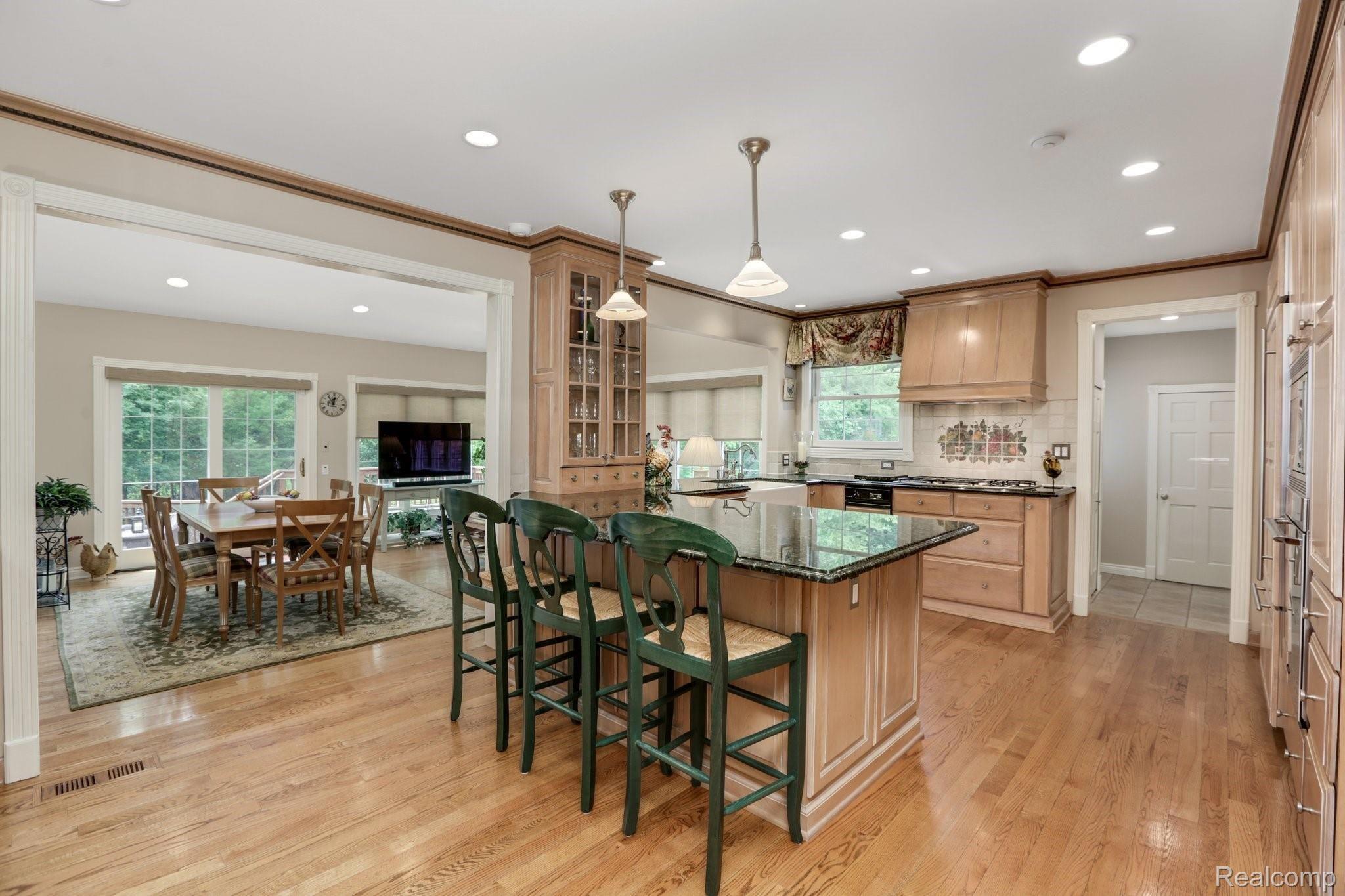 4808 Rivers Edge Drive Troy, MI 48098 - Photo 8 of 40 Large kitchen opens to a light-filled family room