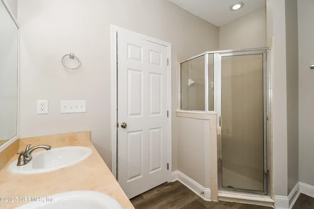 a bathroom with a tub sink and shower