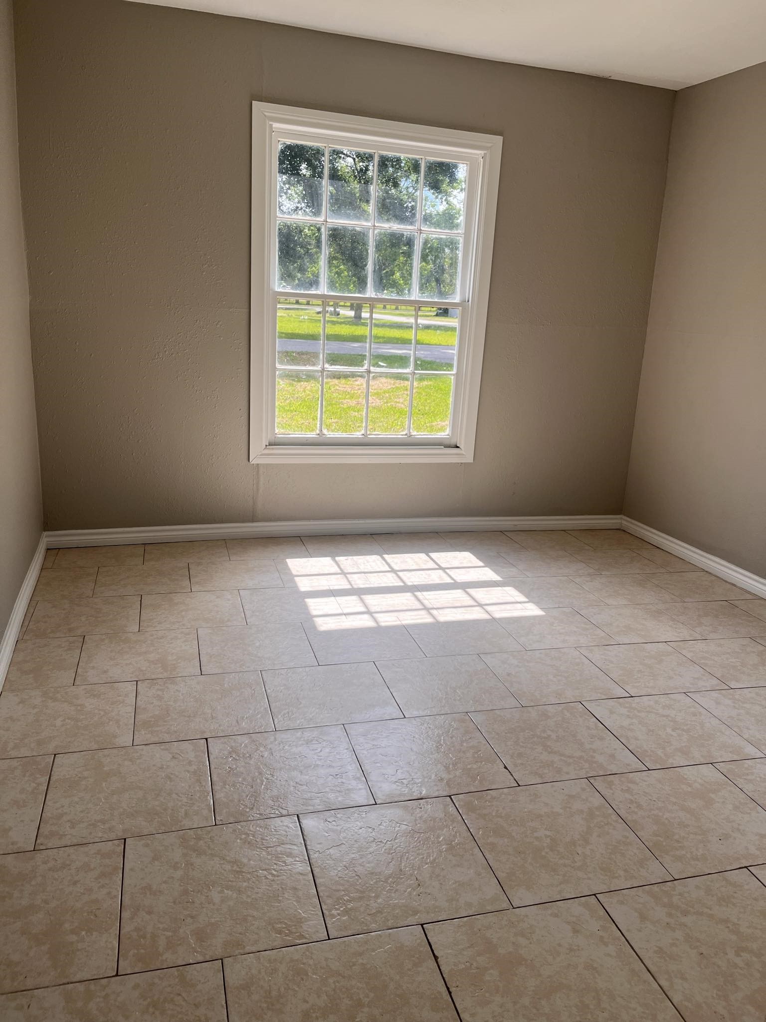 4980 Chambers Street Beaumont, TX 77705 - Photo 20 of 23 a view of an empty room with a window