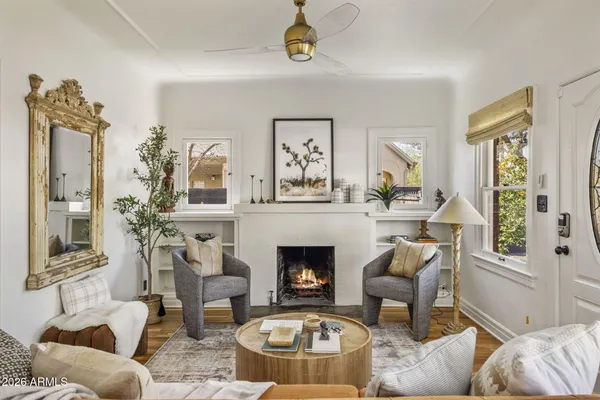 a living room with furniture and a fireplace