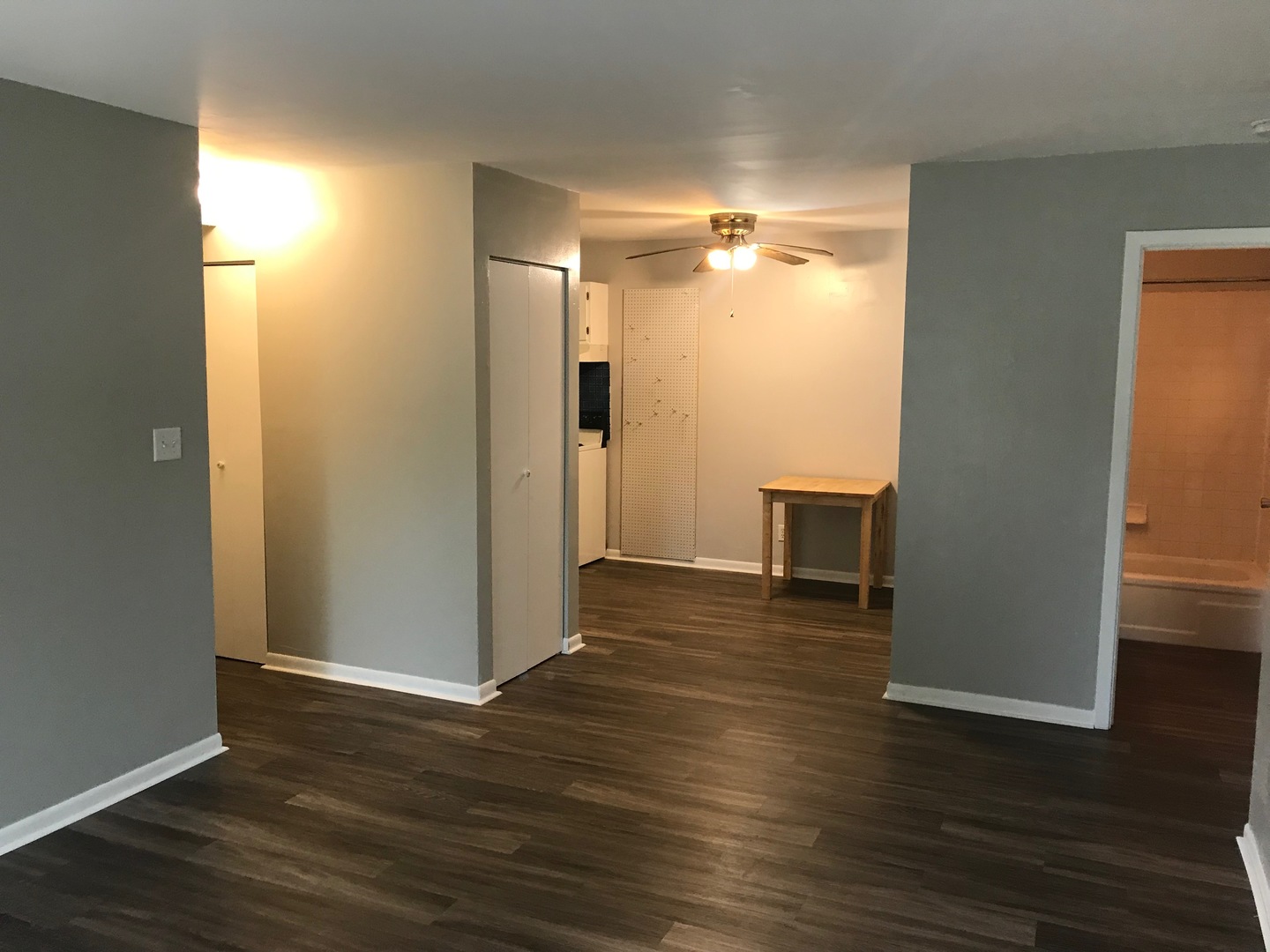 2400 Light Road, Unit 106 Oswego, IL 60543 - Photo 4 of 13 a view of empty room with wooden floor