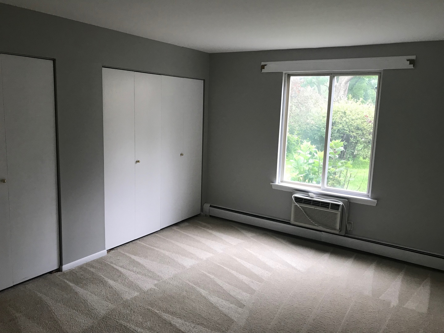2400 Light Road, Unit 106 Oswego, IL 60543 - Photo 6 of 13 an empty room with a window