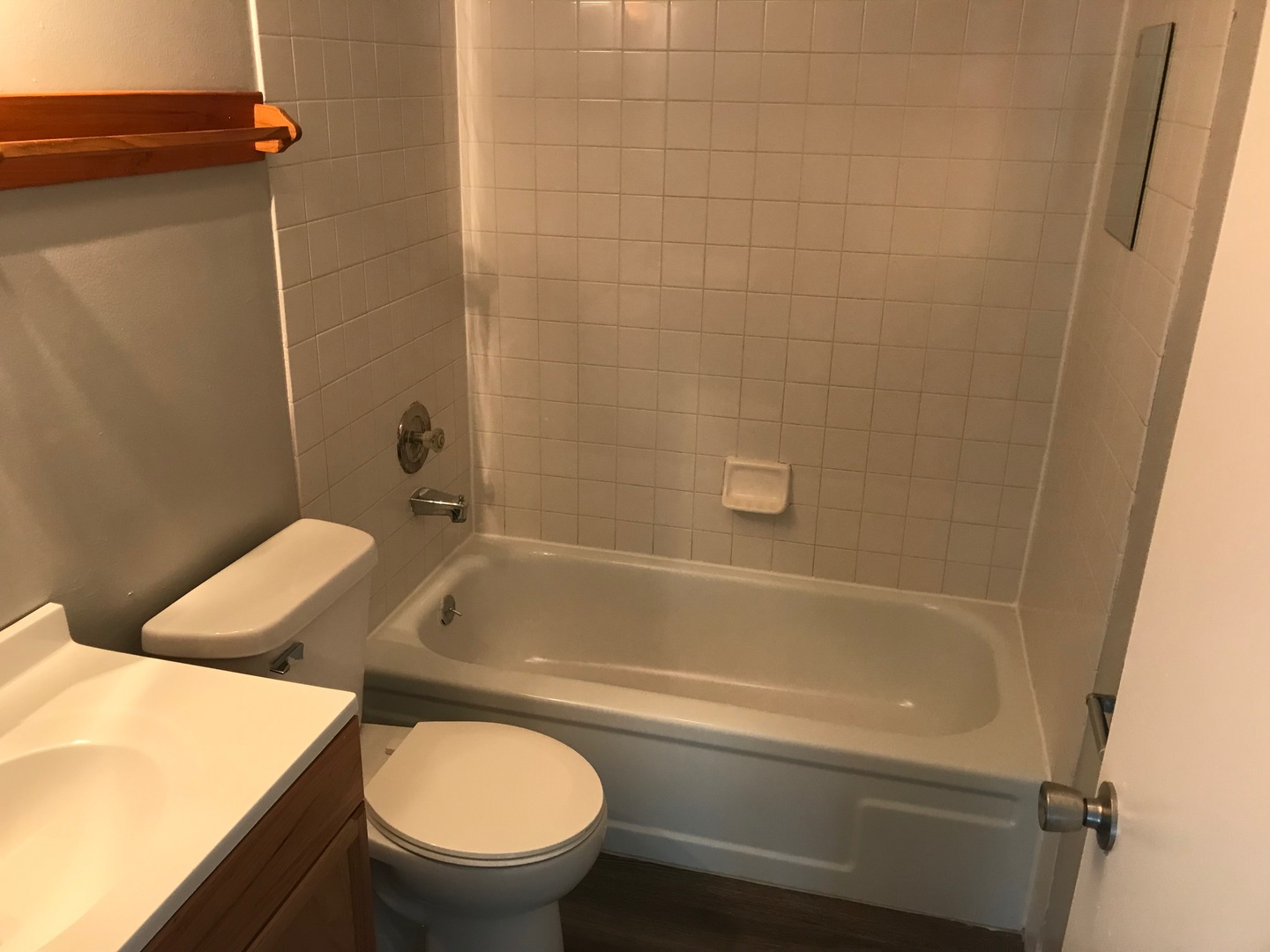 2400 Light Road, Unit 106 Oswego, IL 60543 - Photo 7 of 13 a bathroom with a toilet and a bathtub