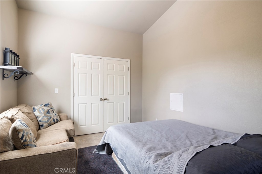 2145 Big Valley Road Lakeport, CA 95453 - Photo 14 of 45 a bedroom with a couch and a window