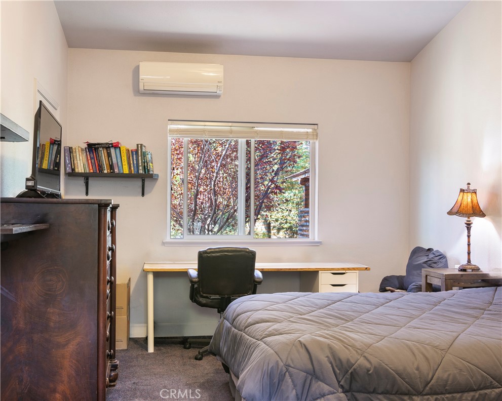 2145 Big Valley Road Lakeport, CA 95453 - Photo 18 of 45 a bedroom with a bed and a large window