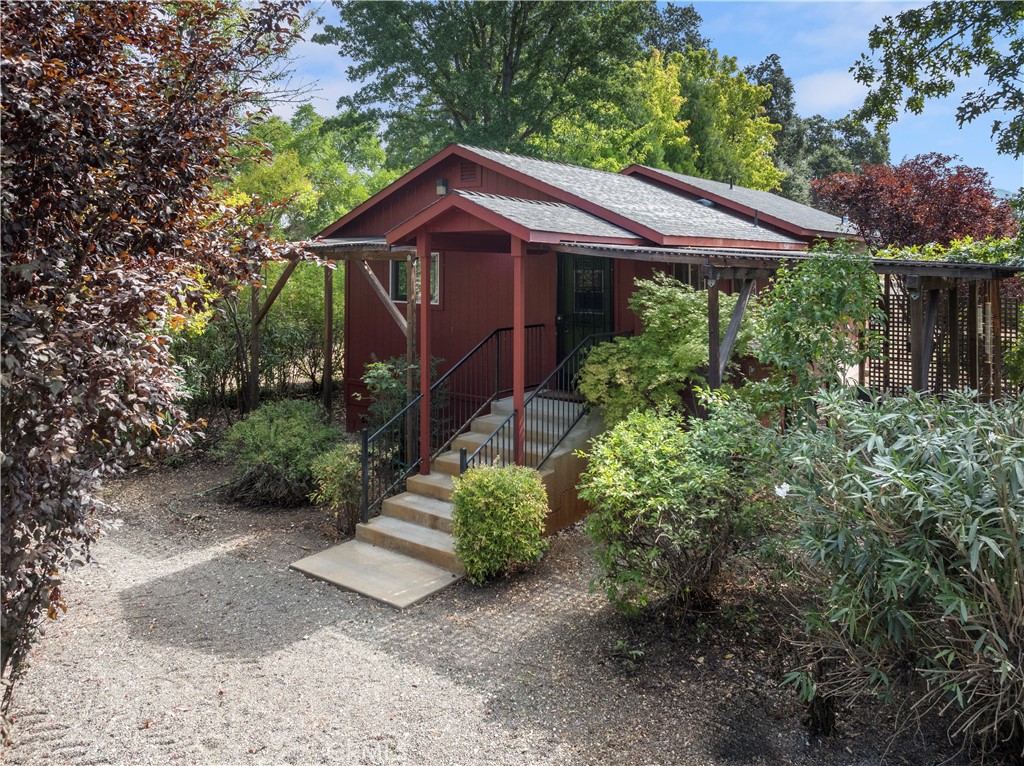 2145 Big Valley Road Lakeport, CA 95453 - Photo 25 of 45 a view of a house with a small yard plants and large tree