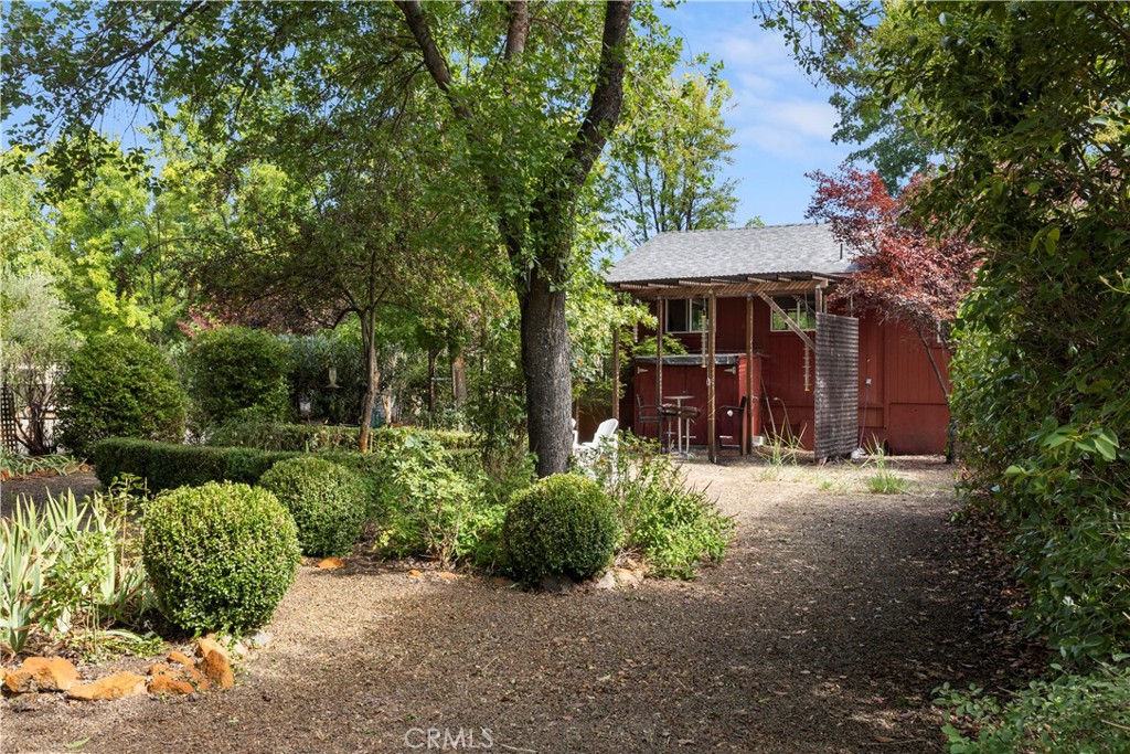 2145 Big Valley Road Lakeport, CA 95453 - Photo 27 of 45 a view of a patio with table and chairs potted plants and large tree