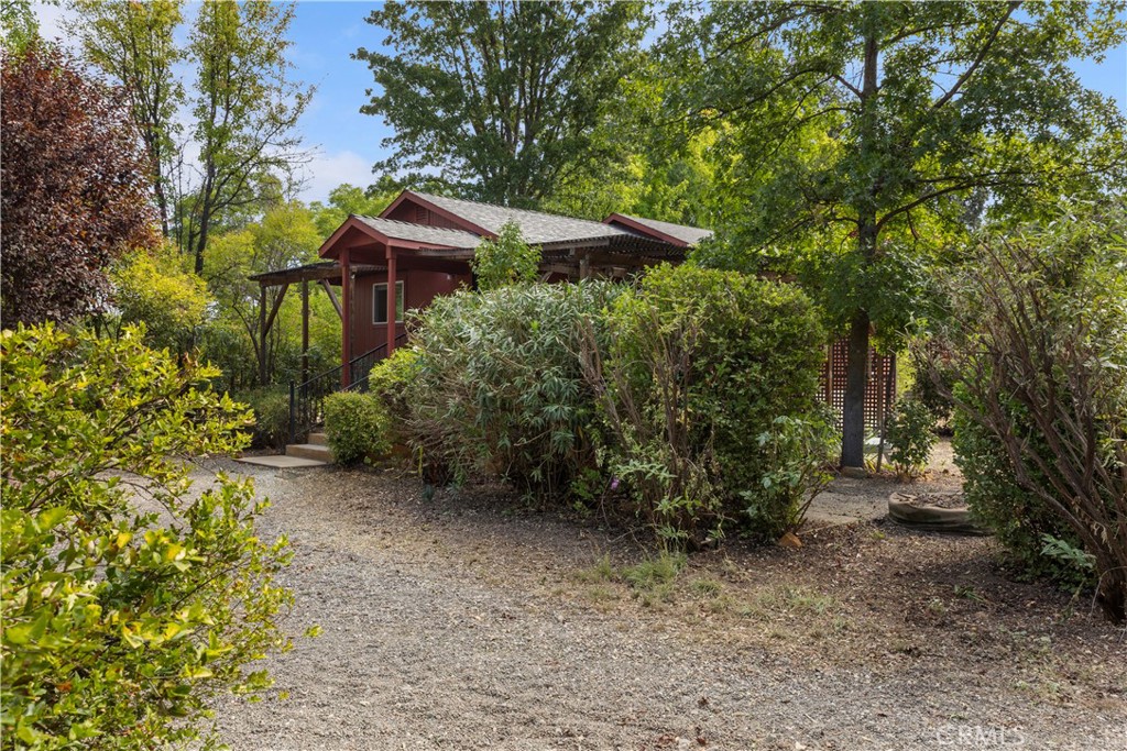2145 Big Valley Road Lakeport, CA 95453 - Photo 32 of 45 a backyard of a house with lots of green space