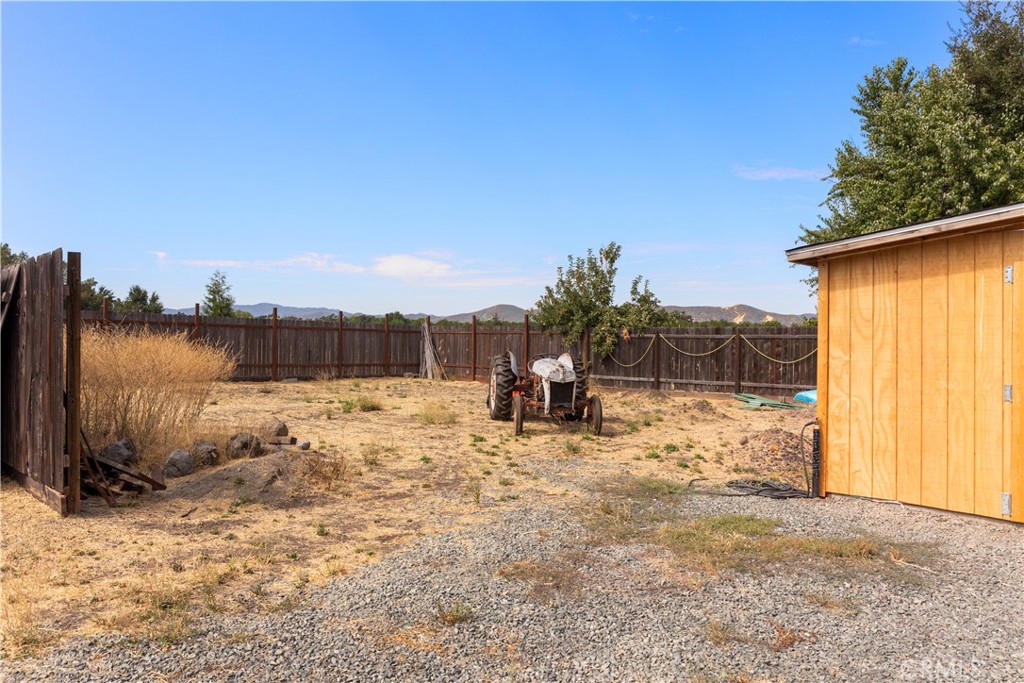 2145 Big Valley Road Lakeport, CA 95453 - Photo 43 of 45 a view of a yard with a tree