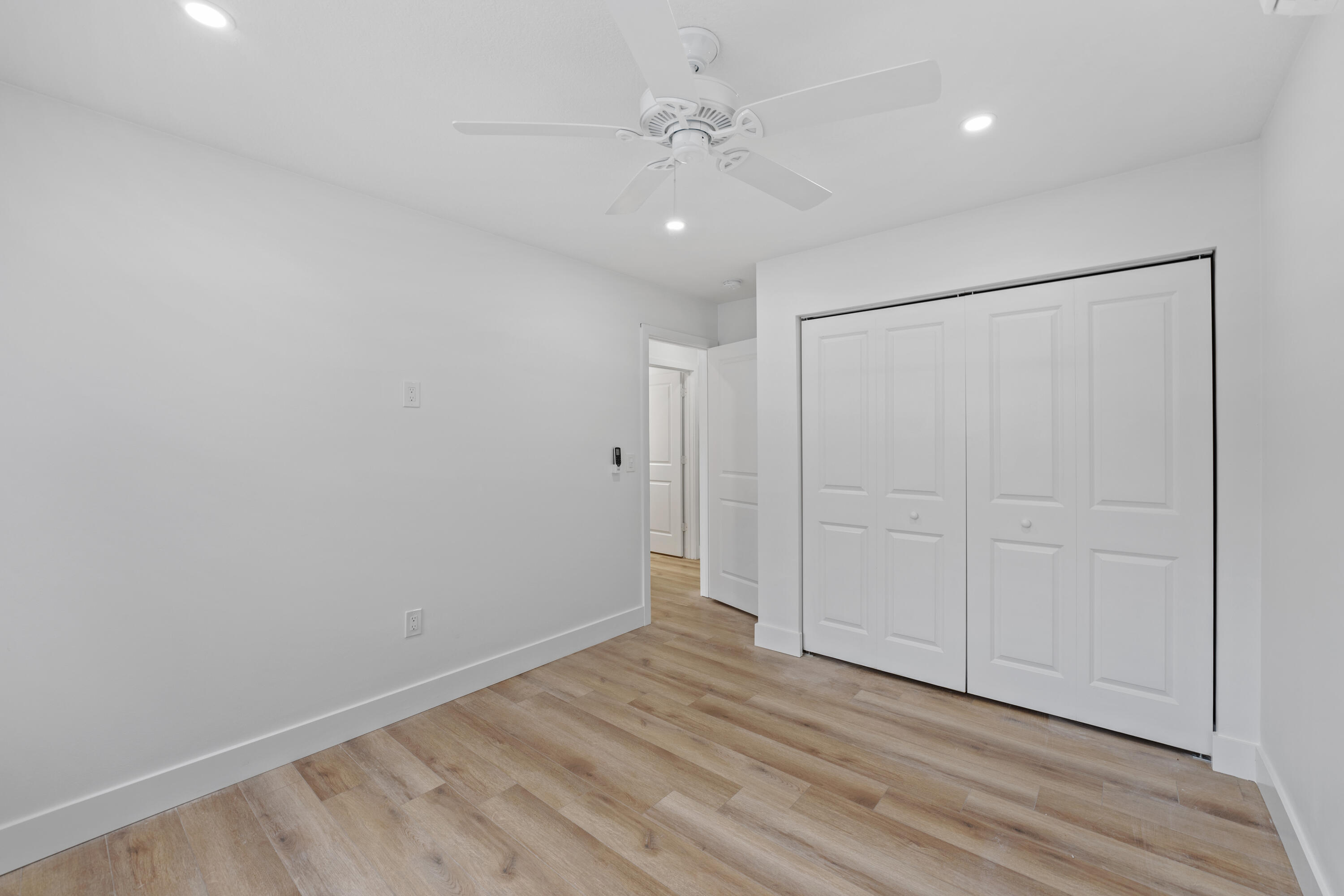 1279 Beach Road, Unit 2 Singer Island, FL 33404 - Photo 16 of 20 wooden floor in an empty room