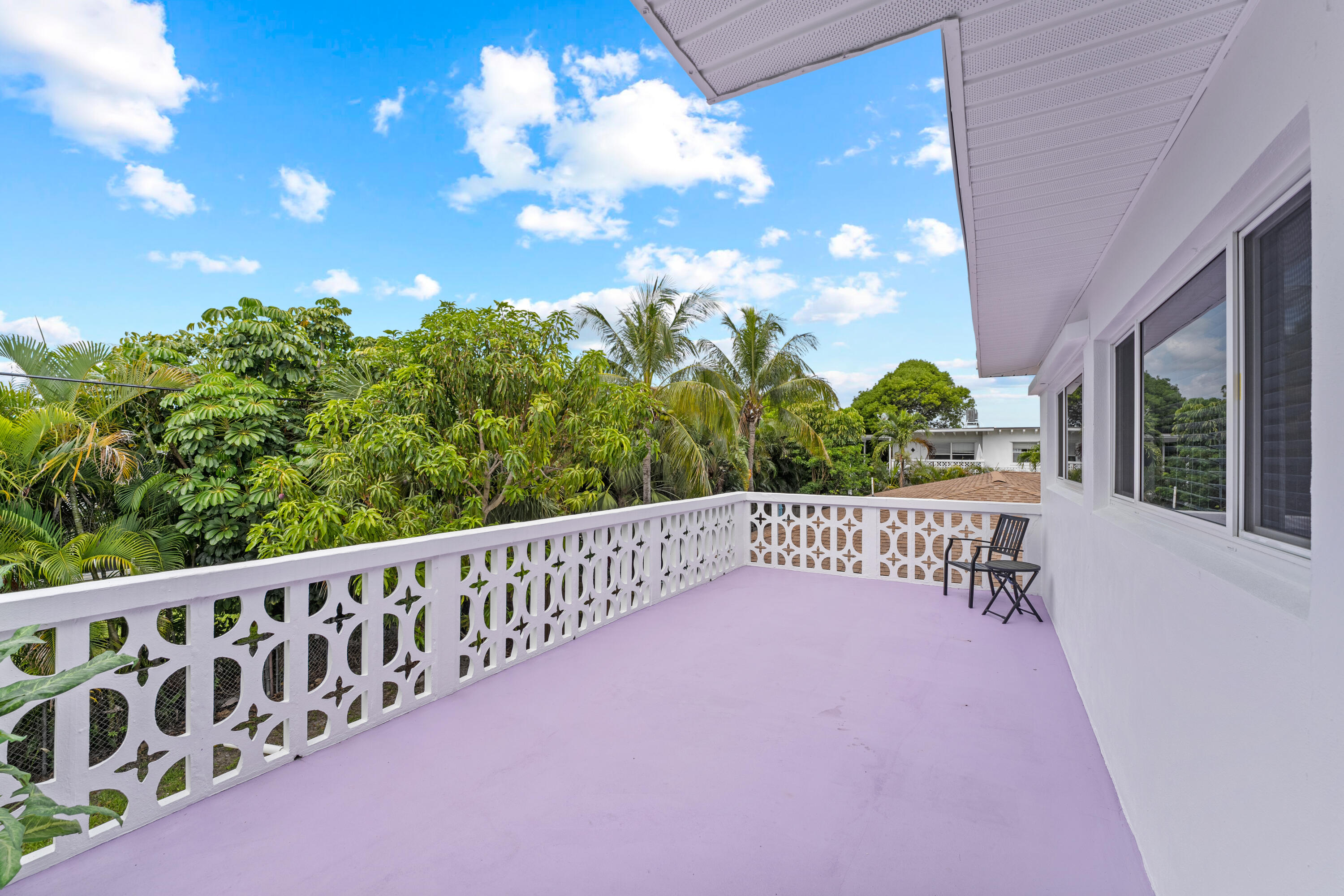 1279 Beach Road, Unit 2 Singer Island, FL 33404 - Photo 18 of 20 a view of a balcony with wooden fence