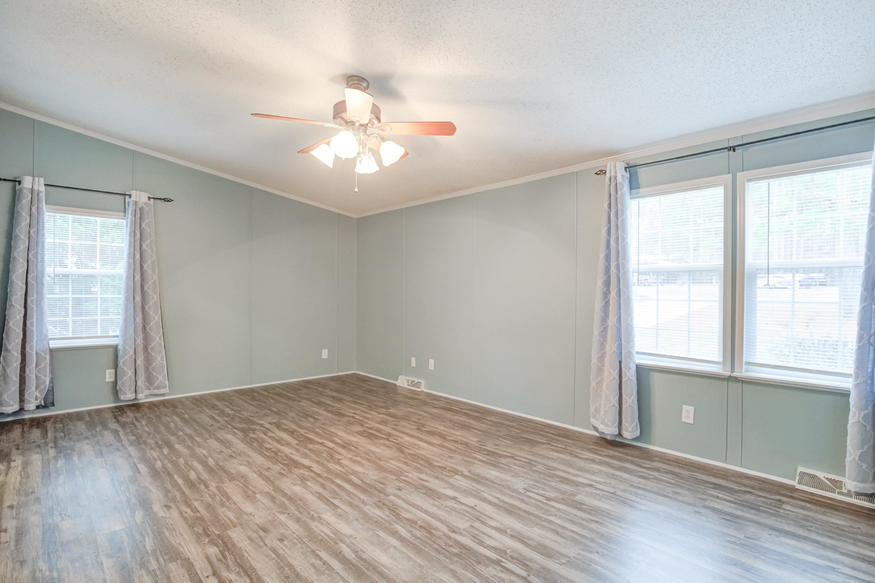 32 Red Oak Drive Smithfield, NC 27577 - Photo 20 of 47 a view of an empty room with wooden floor and a window
