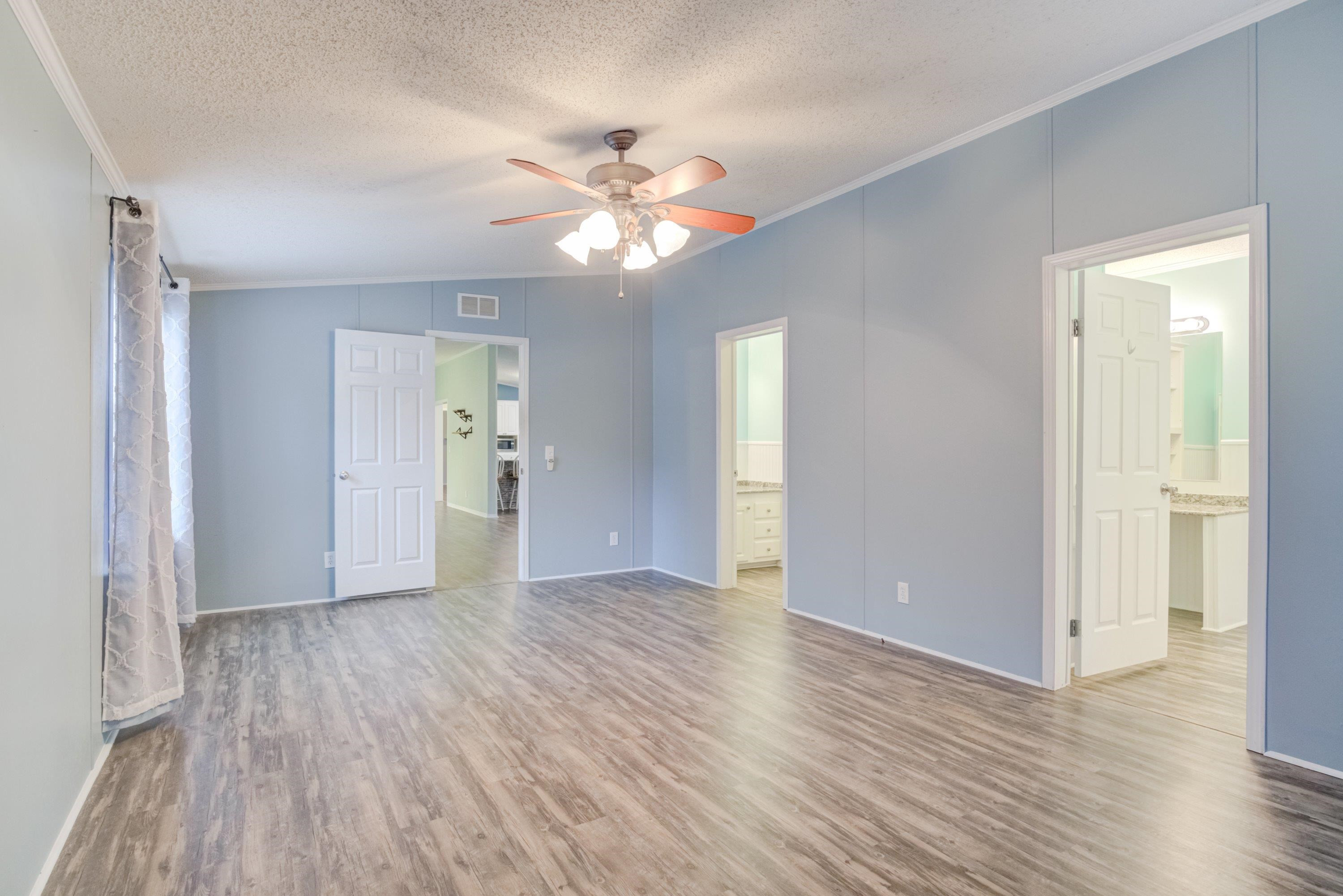 32 Red Oak Drive Smithfield, NC 27577 - Photo 21 of 47 a view of an empty room with wooden floor and a window