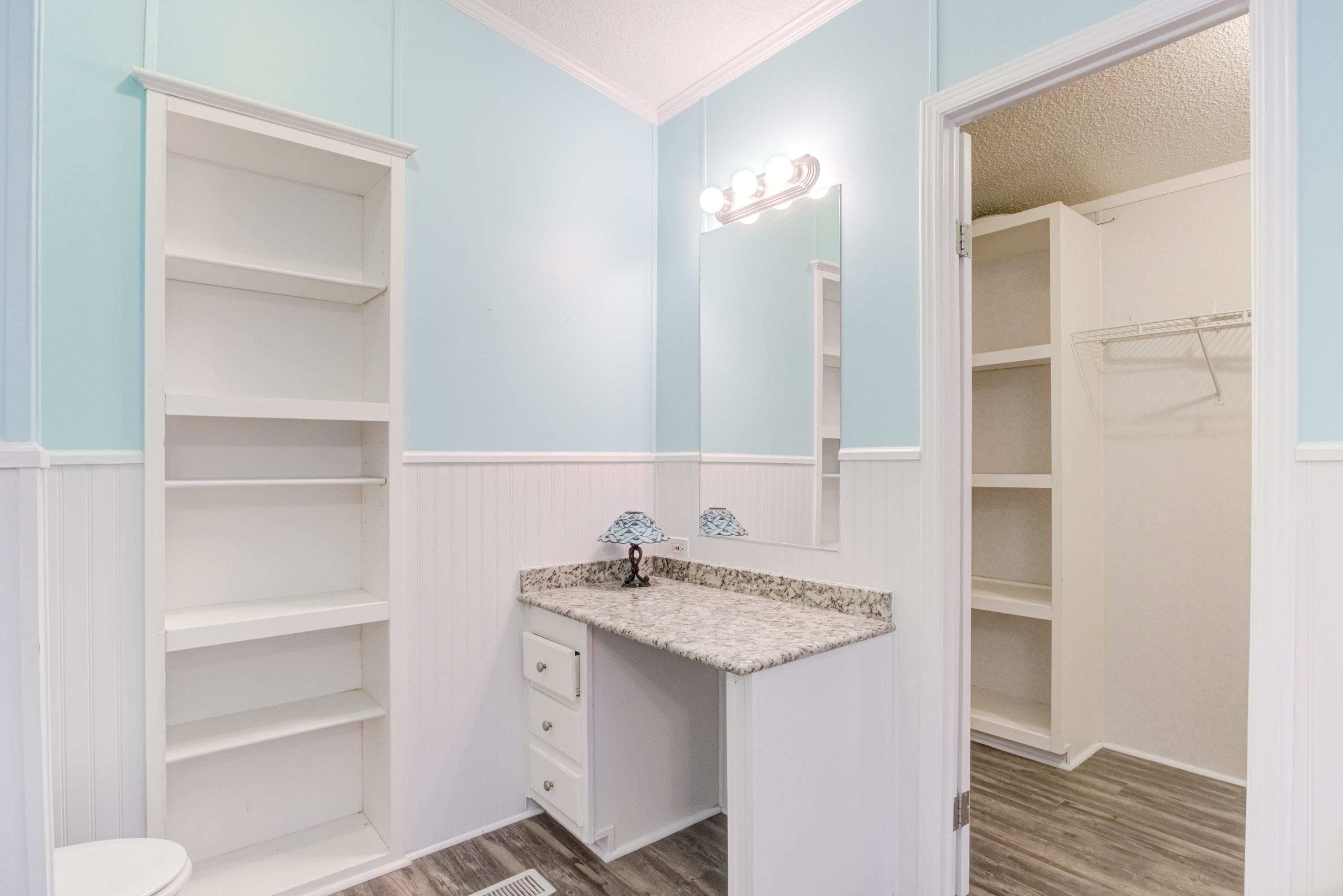 32 Red Oak Drive Smithfield, NC 27577 - Photo 24 of 47 a bathroom with a sink and a mirror