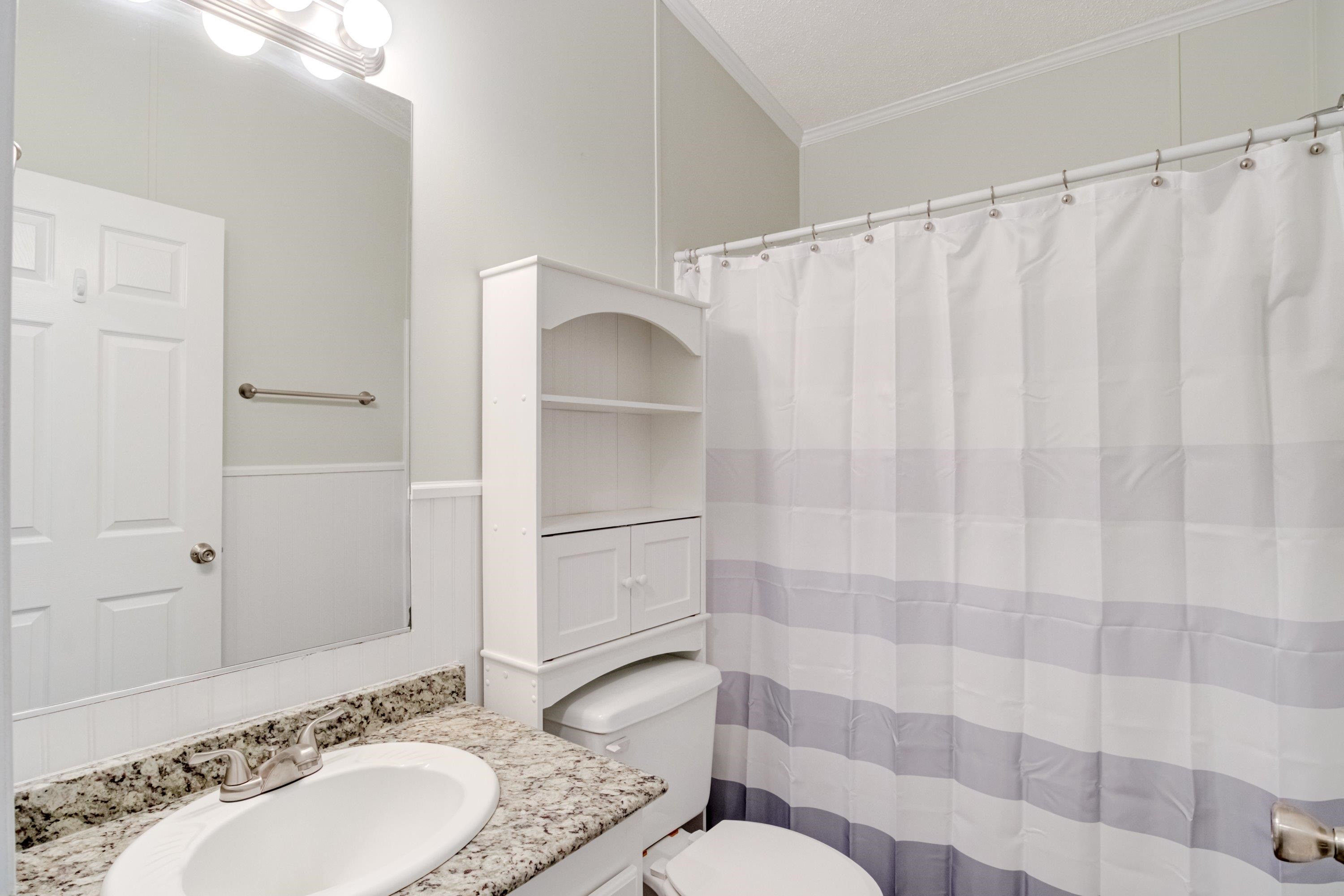 32 Red Oak Drive Smithfield, NC 27577 - Photo 28 of 47 a bathroom with a granite countertop sink and a mirror