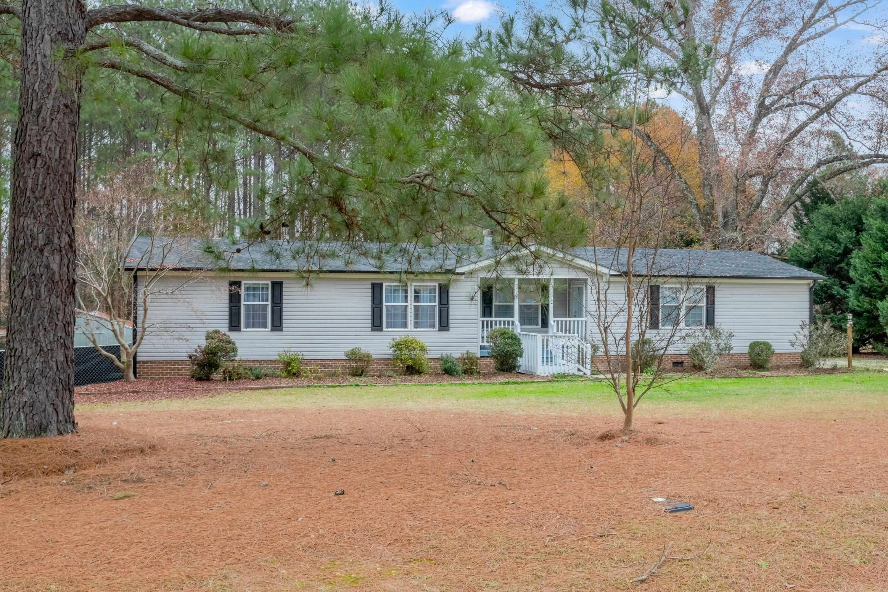 32 Red Oak Drive Smithfield, NC 27577 - Photo 3 of 47 a view of a house with a yard and large trees